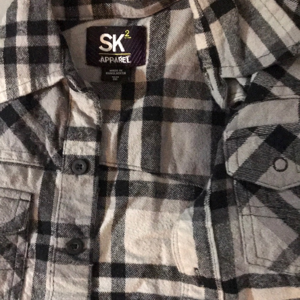 Black and grey flannel button down shirt with blue detail on the front.
